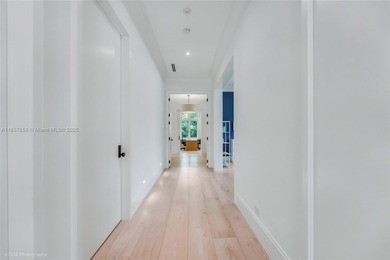 Set on a rare, oversized 56,192 SF lot in one of Coral Gables'