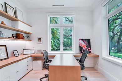 Set on a rare, oversized 56,192 SF lot in one of Coral Gables'