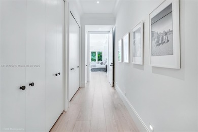 Set on a rare, oversized 56,192 SF lot in one of Coral Gables'