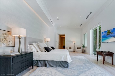 Set on a rare, oversized 56,192 SF lot in one of Coral Gables'