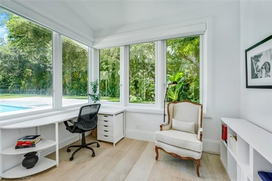 Set on a rare, oversized 56,192 SF lot in one of Coral Gables'