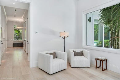 Set on a rare, oversized 56,192 SF lot in one of Coral Gables'