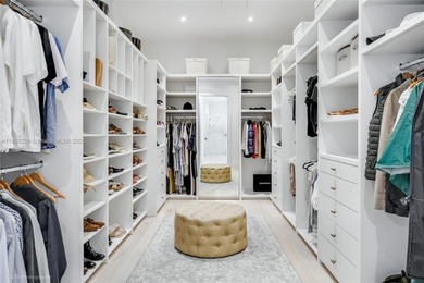 Set on a rare, oversized 56,192 SF lot in one of Coral Gables'