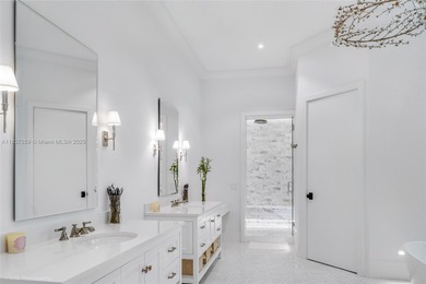 Set on a rare, oversized 56,192 SF lot in one of Coral Gables'