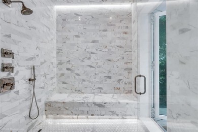 Set on a rare, oversized 56,192 SF lot in one of Coral Gables'