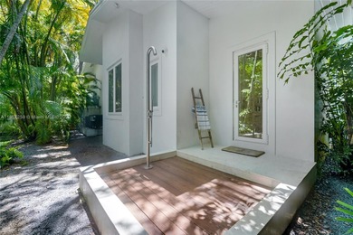 Set on a rare, oversized 56,192 SF lot in one of Coral Gables'