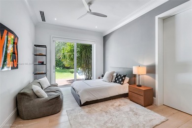 Set on a rare, oversized 56,192 SF lot in one of Coral Gables'