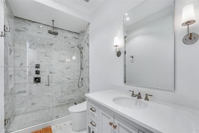 Set on a rare, oversized 56,192 SF lot in one of Coral Gables'