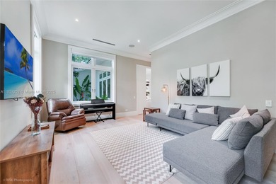 Set on a rare, oversized 56,192 SF lot in one of Coral Gables'