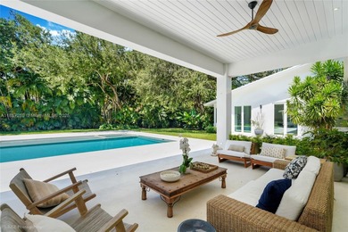 Set on a rare, oversized 56,192 SF lot in one of Coral Gables'