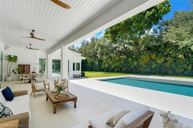 Set on a rare, oversized 56,192 SF lot in one of Coral Gables'
