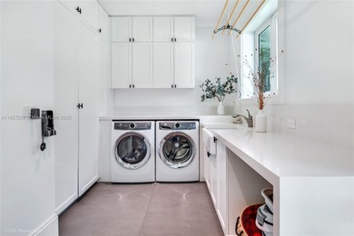 Set on a rare, oversized 56,192 SF lot in one of Coral Gables'