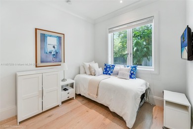 Set on a rare, oversized 56,192 SF lot in one of Coral Gables'