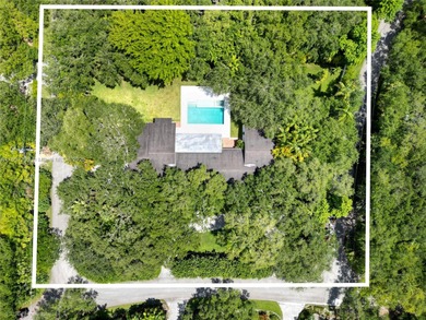 Set on a rare, oversized 56,192 SF lot in one of Coral Gables'