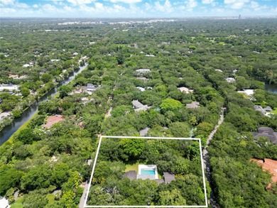 Set on a rare, oversized 56,192 SF lot in one of Coral Gables'