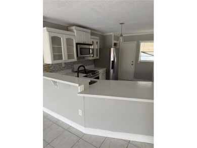 This spacious 2 bedroom condo, is securely located in a gated