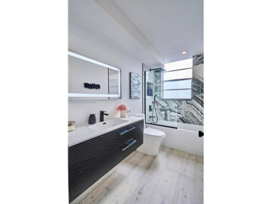 Welcome to this Luxurious Completely Remodeled Art Deco Home in