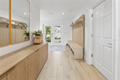 Tucked beyond a newly installed private gate and framed by fresh