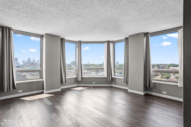 Wake up to sweeping views of the Detroit River and downtown