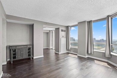 Wake up to sweeping views of the Detroit River and downtown