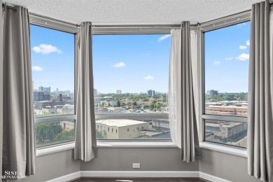 Wake up to sweeping views of the Detroit River and downtown