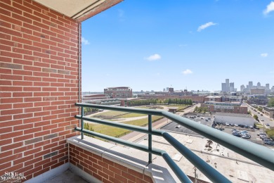 Wake up to sweeping views of the Detroit River and downtown