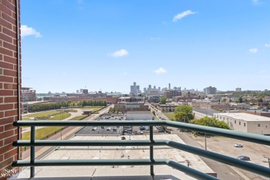 Wake up to sweeping views of the Detroit River and downtown