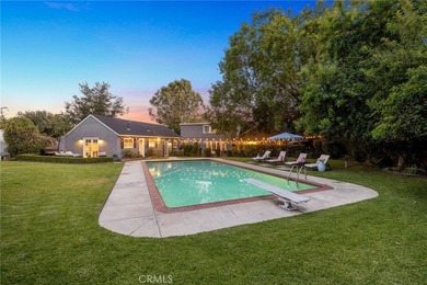 Discover this charming Cape Cod-style home nestled on a generous