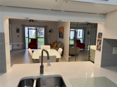 Enjoy the peace and quiet lake view from this bright ground