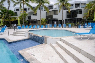 Stunning Bayfront Condo in Moon Bay with Deeded Boat Slip & Boat