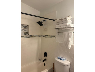 Stunning one-story villa with breathtaking lakefront views! This