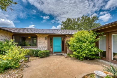 This charming 3 bedroom/2.5 bath home on Lake LBJ is a must see