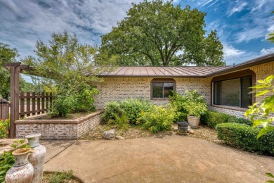 This charming 3 bedroom/2.5 bath home on Lake LBJ is a must see