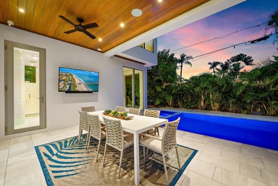 A vision of modern Palm Beach luxury, this brand-new 2025