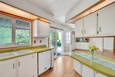 This is a Lovely Home that cuddles the Top of the Hill on the