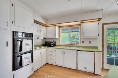 This is a Lovely Home that cuddles the Top of the Hill on the