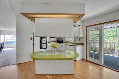 This is a Lovely Home that cuddles the Top of the Hill on the