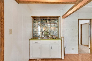 This is a Lovely Home that cuddles the Top of the Hill on the