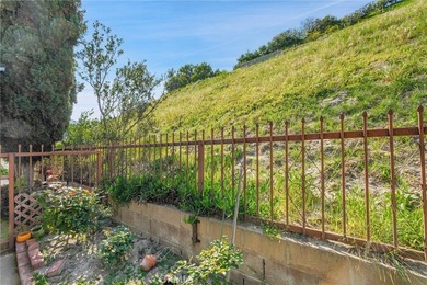 This is a Lovely Home that cuddles the Top of the Hill on the