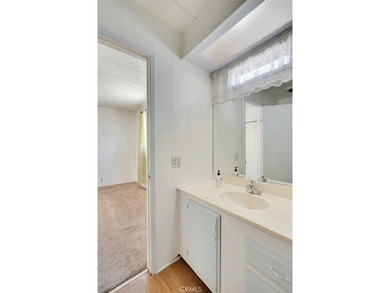 This is a Lovely Home that cuddles the Top of the Hill on the