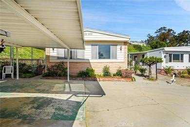 This is a Lovely Home that cuddles the Top of the Hill on the