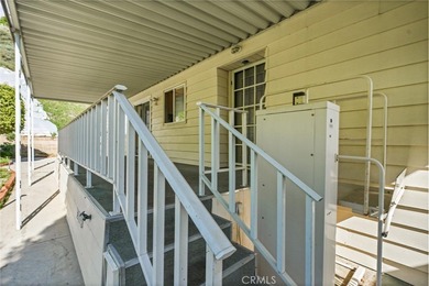 This is a Lovely Home that cuddles the Top of the Hill on the