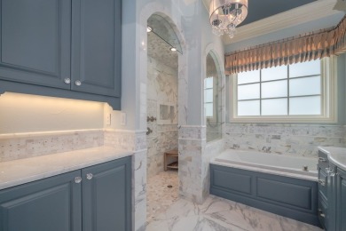 A stunning French-style home situated along a dramatic coastal