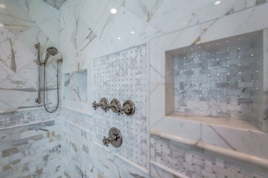 A stunning French-style home situated along a dramatic coastal