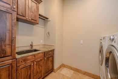 A stunning French-style home situated along a dramatic coastal