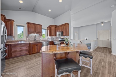 Welcome to this stunning 4-bedroom, 3.5-bath reverse floorplan