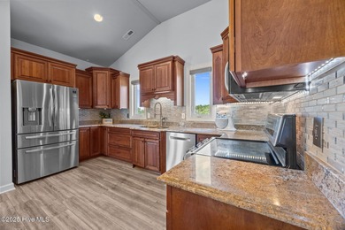 Welcome to this stunning 4-bedroom, 3.5-bath reverse floorplan