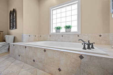 Welcome to this stunning 4-bedroom, 3.5-bath reverse floorplan