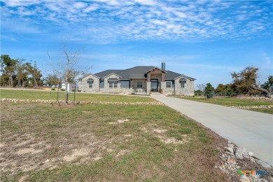 Nestled on a sprawling 1.6-acre lot, this stunning custom home