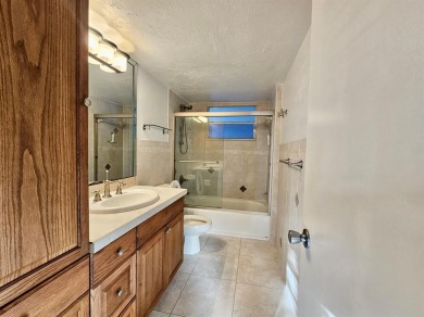 Beautiful 1BR/1.5BA condo with ceramic tile flooring in gated